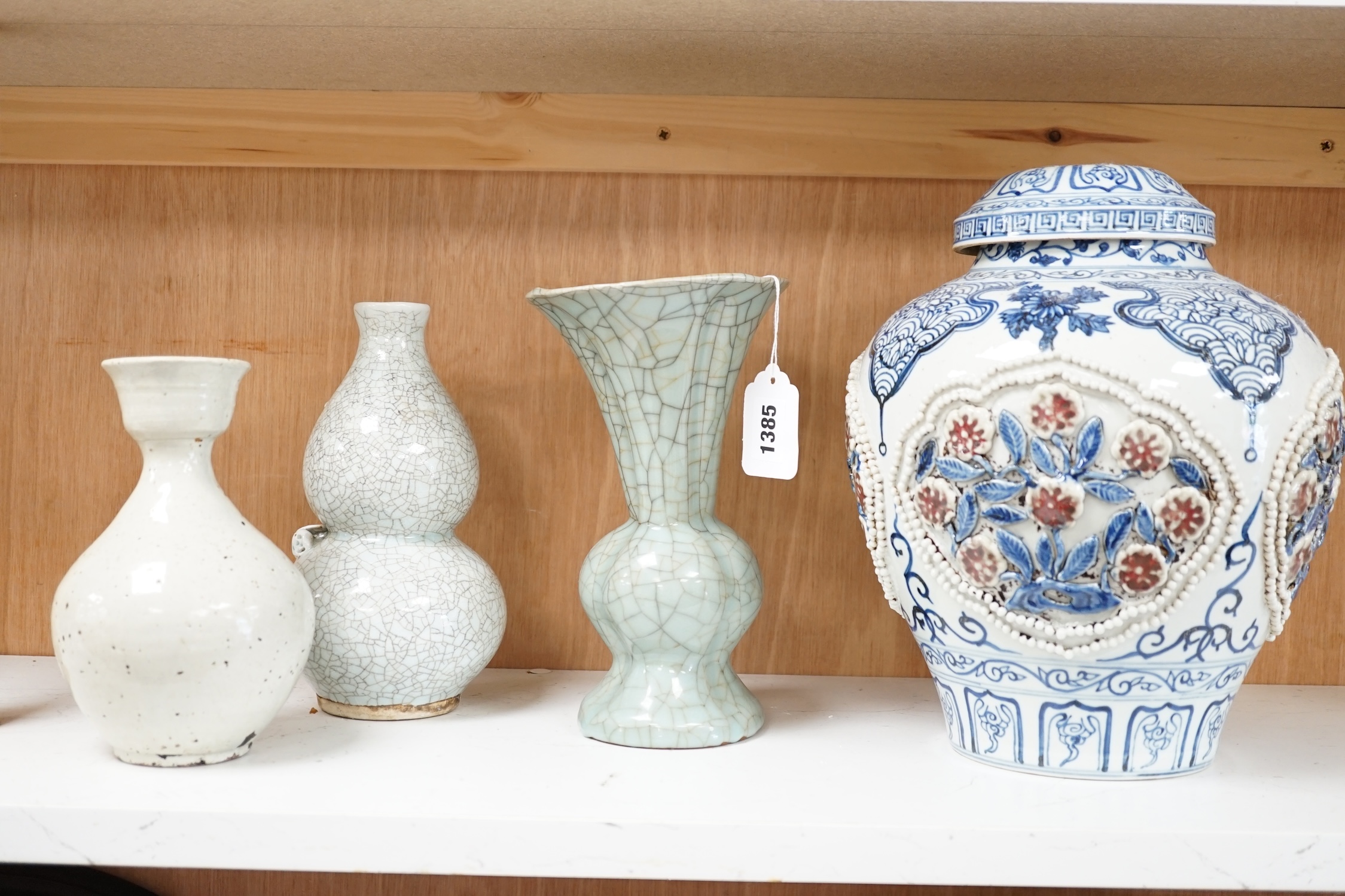 A Chinese underglaze blue and copper red lamp, two crackle glaze vases and a studio pottery bottle, largest 29cm high. Condition - fair